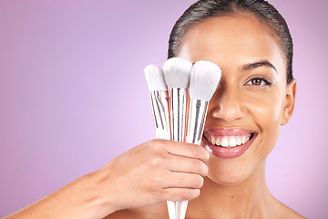 Image showing Beauty, cosmetics and woman with brushes for makeup on purple background for skincare, fashion and style. Cosmetology, aesthetic and girl with brush set for foundation, beauty products and facial