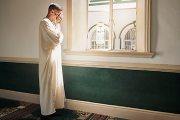 Image showing Muslim, prayer or man in a mosque praying to Allah for spiritual mindfulness, support or wellness in Doha, Qatar. Religion, peace or Islamic person in temple to worship or praise God with gratitude