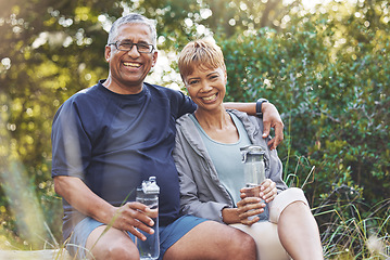 Image showing Nature, hiking and portrait of a senior couple resting while doing outdoor walk for exercise. Happy, smile and elderly man and woman in retirement trekking together for wellness in a forest in Brazil