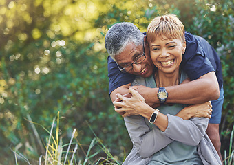 Image showing Nature, love and man hugging his wife with care, happiness and affection while on an outdoor walk. Happy, romance and portrait of a senior couple in retirement embracing in the forest, woods or park.