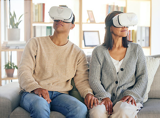 Image showing Virtual reality, 3d and a couple in the interactive metaverse while together on a sofa in the living room of a home. VR, goggles and gaming with a man and woman in their house to relax or video game