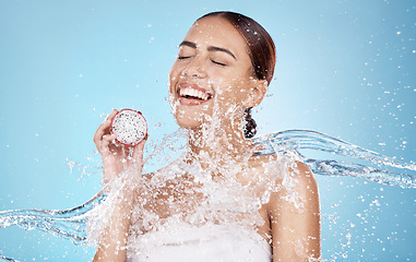 Image showing Beauty, skincare and woman with dragon fruit and water in studio for skincare products, cosmetics and spa. Wellness, detox and happy girl with fruit for natural, organic and healthy facial treatment