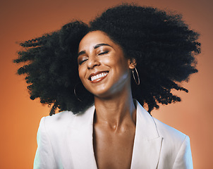 Image showing Black woman, beauty and hair with hair care and happy with afro, makeup with cosmetic care, face and skincare. Dance, freedom with facial and natural curly hair texture against studio background