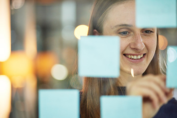 Image showing Planning, strategy and woman writing on glass wall sticky note, brainstorming idea for creative startup agency. Market research, goals and target ideas, designer at workshop with mindmap for business