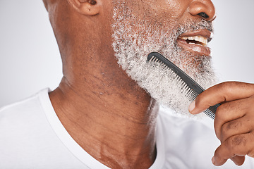 Image showing Elderly, black man and comb for beard, beauty and grooming with hygiene and cleaning face zoom. Hair care, brush body hair and wellness with cosmetic care and natural against studio background