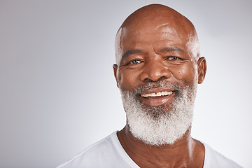 Image showing Senior black man, face and self care with skincare, dermatology and cosmetics for clean, glow and fresh skin. Headshot of African male with a beard on grey studio background for beauty spa treatment