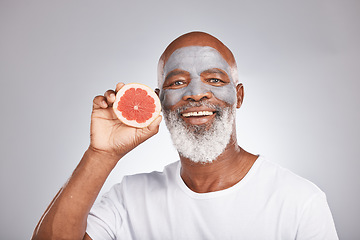 Image showing Grapefruit, face mask and portrait of man, healthy skincare and beauty, wellness and makeup of anti aging, detox or natural facial cleaning. Happy face, studio male model and vitamin c fruits of glow