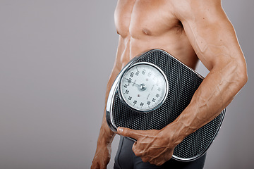 Image showing Fitness, man and scale for body wellness nutrition, diet and exercise advertising for weight loss. Lose weight and workout lifestyle model with muscle on gray studio mockup for health marketing.