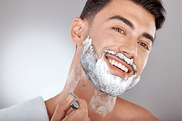 Image showing Grooming, foam and shaving with face of man with razor for beauty, hygiene and skincare with morning routine. Self care, facial and shave beard with model and cream product for wellness and cleaning