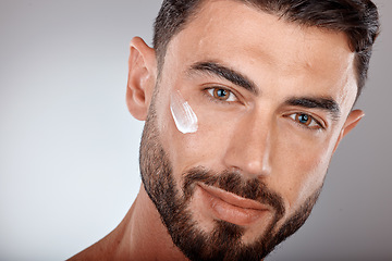 Image showing Man, face and cream for skincare and beauty zoom with sunscreen, facial portrait and moisturizer. Lotion, skin wellness and glow with treatment, cosmetic care mockup against studio background