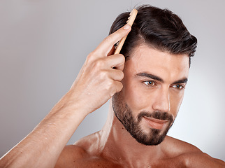 Image showing Comb, beauty or man brushing hair for grooming advertising or marketing salon hair care products. Thinking, studio background or healthy male model with cool hairstyle in morning routine treatment