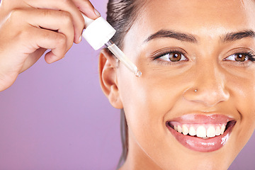 Image showing Woman, facial essential oil and serum for dermatology, natural beauty and aesthetic makeup on purple studio background. Happy model face, skincare and liquid cosmetics, retinol and hyaluronic acid