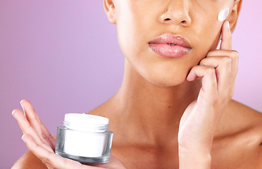 Image showing Skincare, beauty and woman with face cream product for dermatology, health and wellness mock up on a purple background. Aesthetic model in studio for self love, self care and facial spa therapy