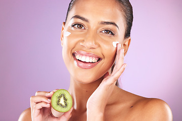 Image showing Cream, kiwi and skincare woman in studio portrait for facial beauty, healthy glow or cosmetics advertising mockup. Self love model smile for vitamin c, nutrition or green fruit in dermatology product