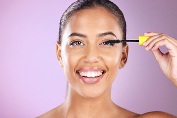 Image showing Woman, face portrait and mascara brush for beauty wellness, cosmetics dermatology and natural skincare glow in purple background studio. Model, facial care and smile for happiness with makeup tool