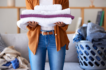 Image showing Laundry, towel and texture with cleaning service and woman cleaner, hygiene and disinfection for housekeeping. Spring cleaning, clean fabric and housekeeper with fresh textile, washing and house work