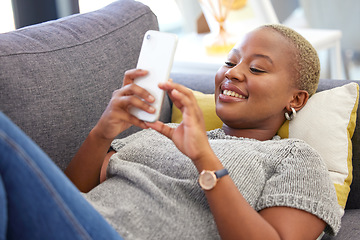 Image showing Social media, relax and black woman with a phone for communication, mobile chat and app on the sofa. Connection, internet and calm African girl with a mobile for online conversation on the couch