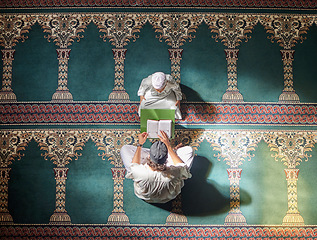 Image showing Muslim pray, child or man in praying with Quran for peace, mindfulness or support from Allah in holy mosque. Top view, Islamic kid or person studying or praying to help worship God on Ramadan Kareem