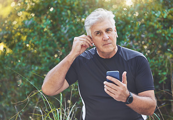 Image showing Fitness, phone or old man listening to music, radio or motivational audio for running exercise or workout. Wellness, relaxing or senior person streaming a podcast or song in headphones in nature park