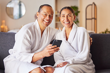 Image showing Senior couple at spa, portrait with smartphone and happy smile, wellness and commitment with romantic trip to luxury resort. Technology, phone and relax together, happiness and romance on holiday