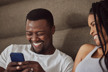 Image showing Black couple, phone and relax happiness in bed for social media streaming, comic meme or quality time together reading online. African man smile, woman laughing and watching funny video on smartphone