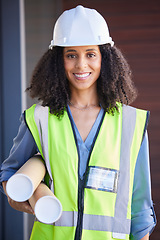 Image showing Portrait, architect and blueprint with a black woman designer wearing a reflective vest and hardhat for construction. Building, architecture or safety with a female engineer holding plans indoors