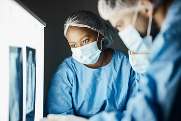 Image showing X ray, exam and covid doctors meeting for a healthcare diagnosis, medical inspection and research results. Strategy, teamwork and surgeon workers doing analysis of a body scan with face mask