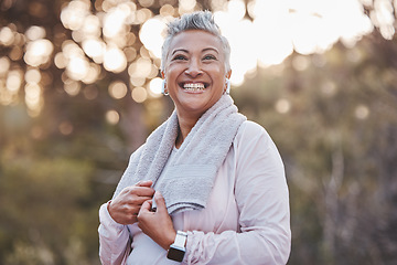 Image showing Fitness, exercise and happy senior woman in nature with a towel for cardio running workout for health and wellness. Elderly female in a forest to run for a healthy lifestyle, body and energy outdoor