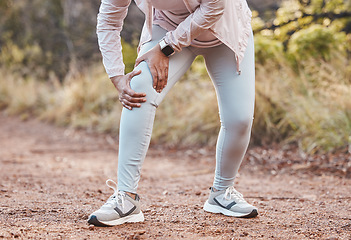 Image showing Sports, knee pain and woman in park after running, exercise and marathon training for healthy lifestyle. Wellness, fitness and hands of female athlete with muscle strain, leg injury and accident