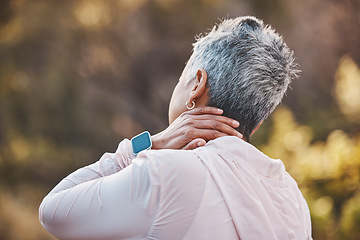 Image showing Back, exercise and senior woman with neck pain, training or workout for wellness, outdoor or health. Mature female, athlete or injury in park, fitness or muscle massage for arthritis or joint tension