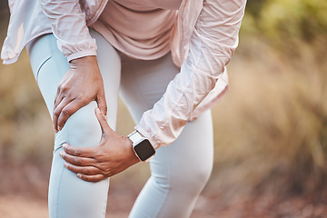 Image showing Fitness, knee pain and woman in park after running, exercise and marathon training for healthy lifestyle. Wellness, sports and hands of female athlete with muscle strain, leg injury and accident