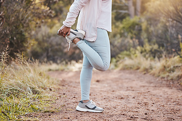 Image showing Woman stretching legs in forest and fitness, run outdoor with nature for cardio and health. Runner sneakers, start exercise and running path, workout with sports motivation and marathon training