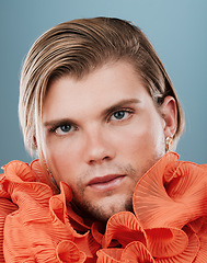 Image showing Beauty, lgbtq and face of a man with fashion for self expression, non binary identity and creative style on blue background in studio. Retro, vintage and portrait of queer model in designer clothing