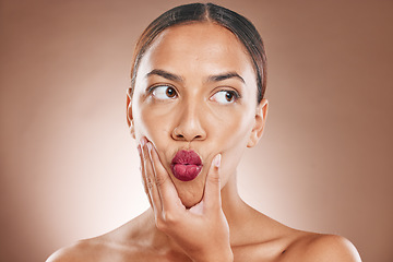 Image showing Lips, face and woman with beauty, lipstick pout with hand and makeup with cosmetic care against studio background. Natural cosmetics, facial treatment with healthy skin and skincare wellness mockup