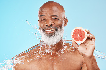 Image showing Grapefruit, water splash and black man for skincare health, vegan product or senior cosmetics advertising, marketing or promotion mockup. Beauty model, shower product and fruit for cleaning benefits