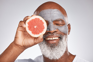 Image showing Skincare, face mask or happy old man with grapefruit marketing or advertising natural vegan diet for glowing skin. Cream, smile, senior black man with beauty or healthy anti aging facial cosmetics