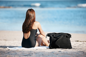 Image showing Young woman sitting on beach, peace by the ocean horizon on summer holiday and Mauritius vacation. Female tourist relaxing at sea, freedom of travelling alone and peaceful content in outdoors