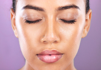 Image showing Makeup, cosmetics and zoom face of a woman marketing a spa product, body glamour and care on a purple studio background. Beauty, skincare and headshot of a model advertising cosmetic glow on skin