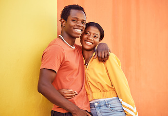 Image showing Black couple, youth and fashion with gen z, hug and together with color and portrait against wall background. Black man, black woman and young with trendy streetwear, mockup and marketing in Nigeria.