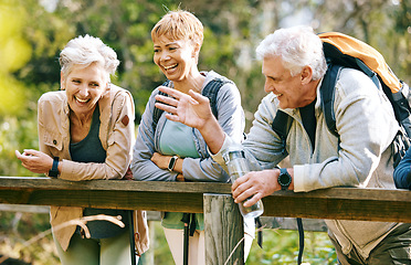 Image showing Elderly, people and hiking with fitness outdoor, friends together in park with trekking in nature and relax on bridge. Travel, freedom and exercise with man and women with active lifestyle motivation