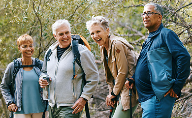 Image showing Nature, hiking and happy senior friends bonding, talking and laughing at comic joke in forest. Happiness, fun and group of elderly people trekking together for health, wellness and exercise in woods.