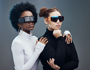 Image showing Fashion, futuristic and cyberpunk with women in sunglasses, young and trendy designer brand with gen z youth. Marketing, diversity and future style with vision and edgy against studio background