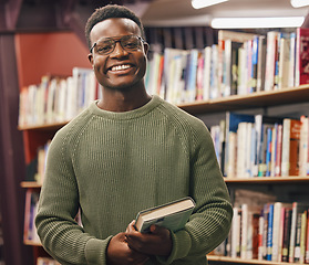 Image showing Black man, student and portrait in library for book, research and education at college with smile. African gen z learner, books and shelf at university for goals, learning and motivation for future