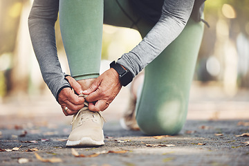 Image showing Elderly runner, hands and shoes for running, fitness in the park with exercise and start run with vitality. Body training, cardio and footwear, active lifestyle and sport outdoor with senior athlete