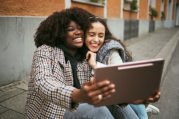 Image showing City, friends and women take selfie on tablet while sitting on sidewalk laughing and happy together. Photo, video call and black woman with girl friend with urban fun and social media profile picture