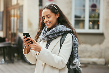 Image showing Woman, outdoor and smartphone for connection, social media and communication. Female student, academic and cellphone to search online, smile and website to scroll internet, happiness and typing