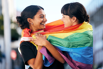 Image showing Lgbtq, happy women and flag for pride, equality and protest of love, support and care in city. Gay, lesbian and couple of friends with rainbow identity, gen z festival and human rights freedom event