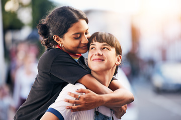 Image showing Piggyback, love and lgbtq couple in the city, happy support and playful smile in Switzerland. Affection, hug and calm lesbian women smiling with pride in identity the urban street on the weekend