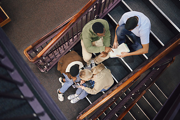 Image showing Above, student group and stairs for study together, thinking and research for exam, test or education. Students, diversity and teamwork for support, ideas and collaboration at university for mission