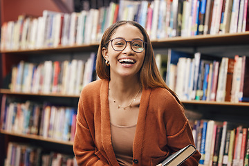 Image showing Face, student and woman in library with book ready for learning. Portrait, university education and happy female from Brazil standing by bookshelf for studying, knowledge and literature research.